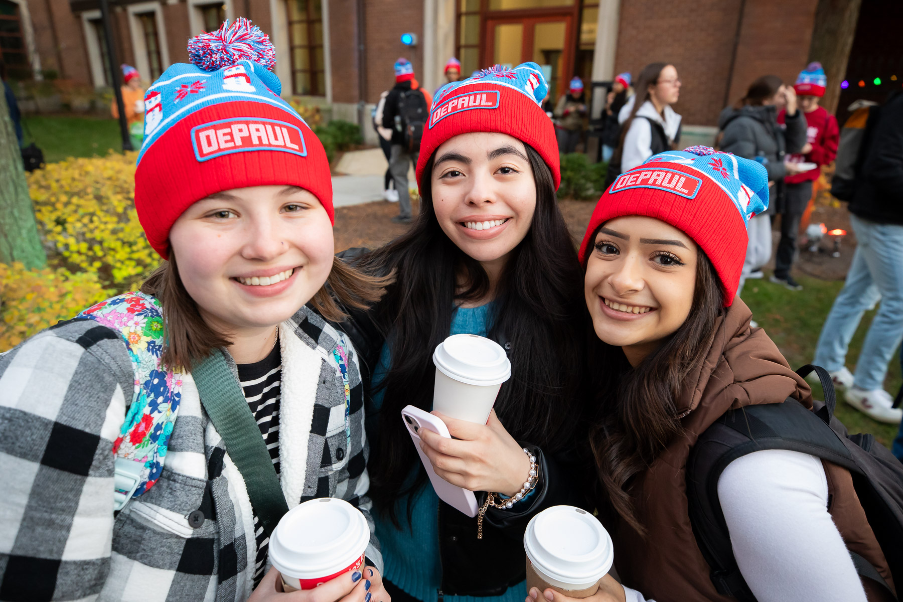 With beautiful weather, students lined up again, this time for classic DePaul winter beanies. (Photo by Jeff Carrion / DePaul University) 